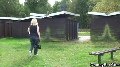 Blonde mature woman is carnal with the man outdoors