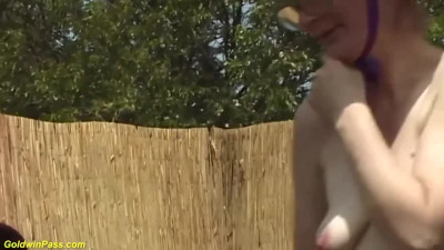 Old woman with glasses is fucked in the backyard