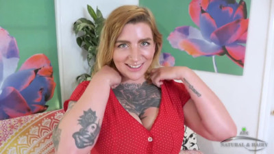 Inked stunner undresses to toy her hairy snatch