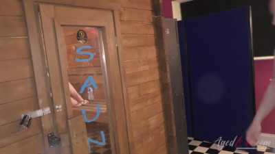 A blonde cougar is riding the big dick in the sauna