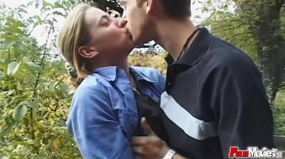 Horny cougar is fucked outdoors in the backyard by a lad
