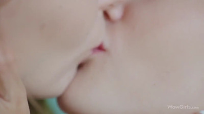 Two nude lesbian girls enjoy hot queer fucking on a bed