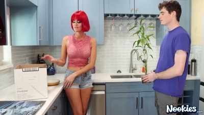 Babe with a red wig on is having sex in the kitchen