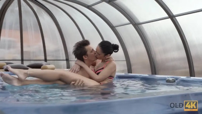 Younger lady finds an older guy to help her cum poolside