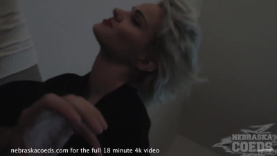 Man is recording the action while a blonde gives him a BJ