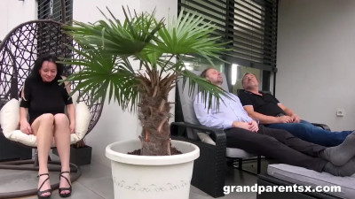 A MILF and a teen are having sex with two hung men