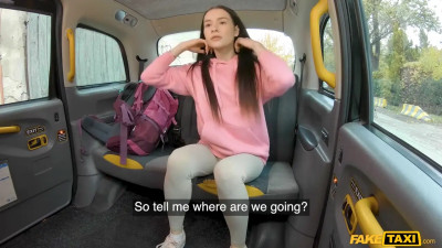 Petite brunette with a cute face is fucked in the taxi